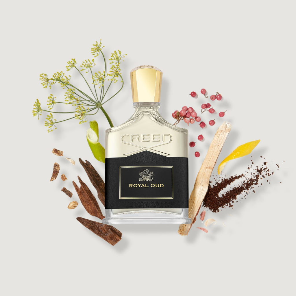 Creed Royal Oud perfume bottle with botanical elements on a light background