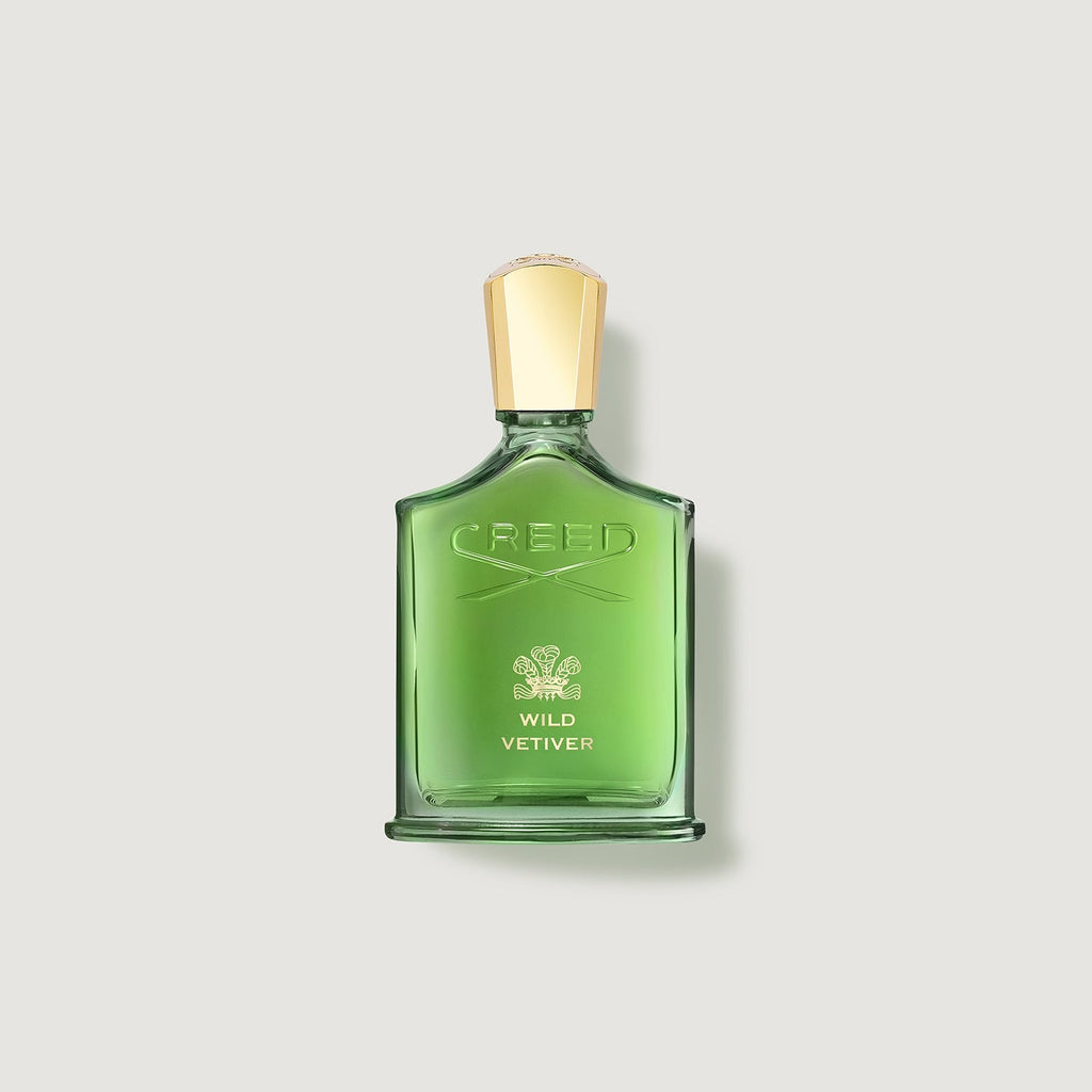 Green Creed Wild Vetiver perfume bottle on a light gray background
