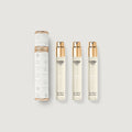 Set of Creed perfume bottles and packaging on a light gray background