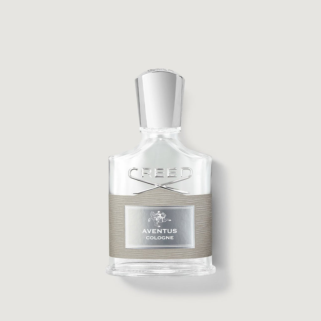 Creed Aventus cologne bottle on a light gray background
