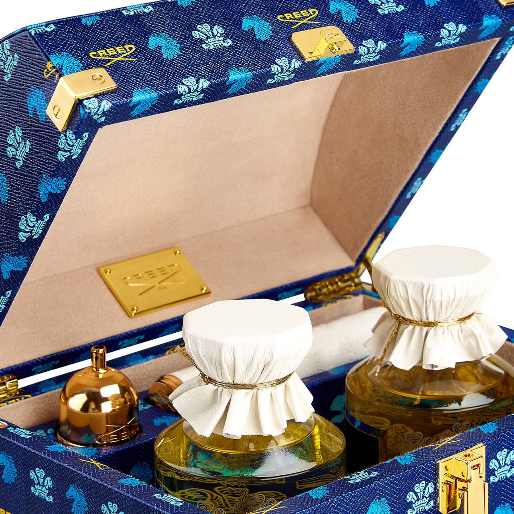 Holiday Trunk Rue Royal close up of the opened trunk with 2 250ml bottles inside and atomizer side angle view