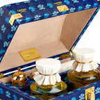 Holiday Trunk Rue Royal close up of the opened trunk with 2 250ml bottles inside and atomizer side angle view