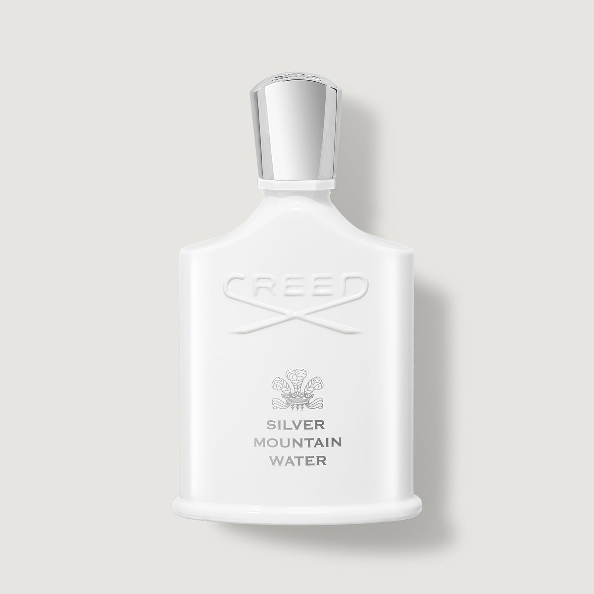 White Creed Silver Mountain Water perfume bottle on a light gray background